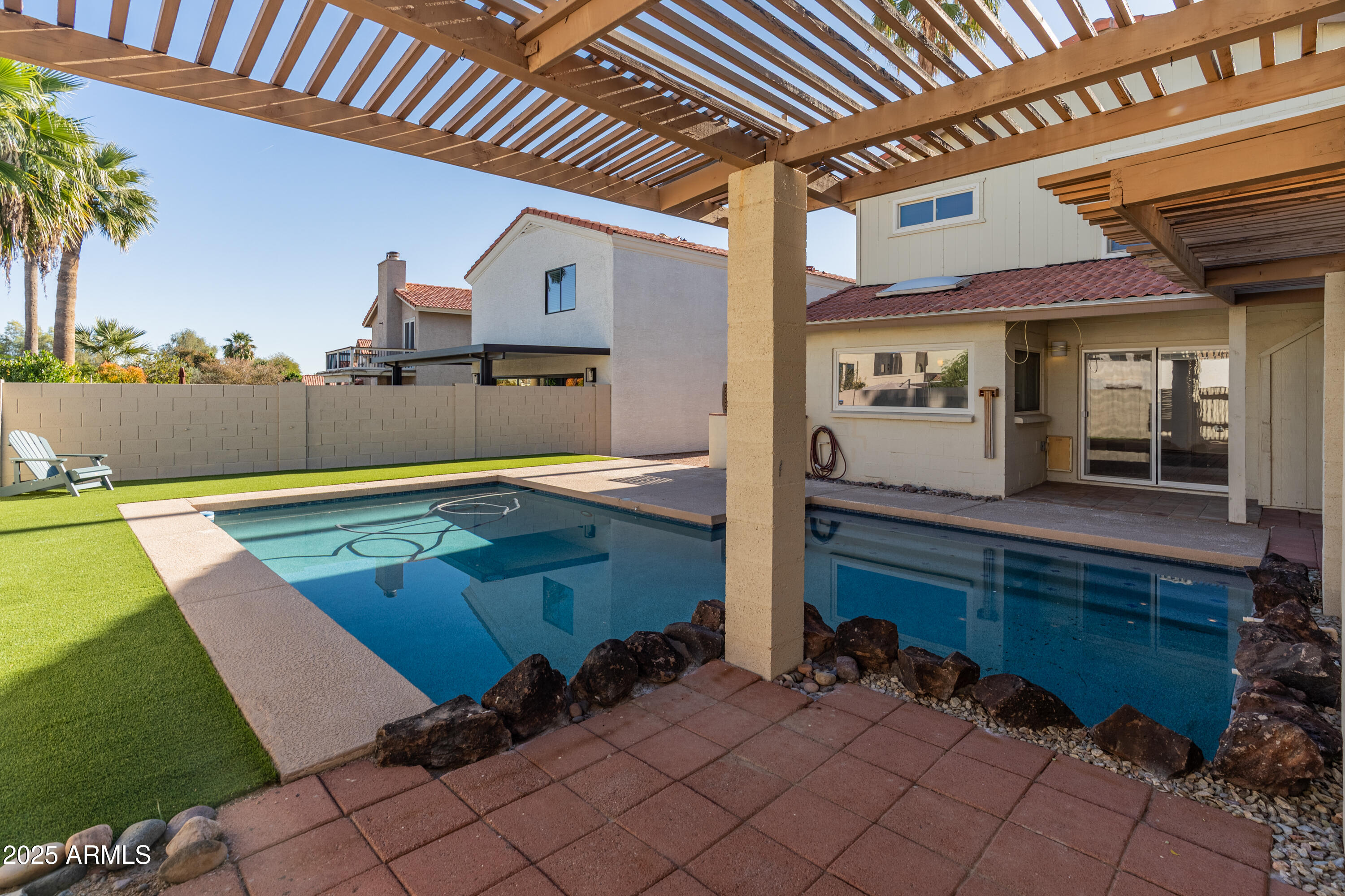 4652 East Piedmont Road Phoenix, AZ 85044 - Photo 20 of 30 an outdoor space with swimming pool and furniture