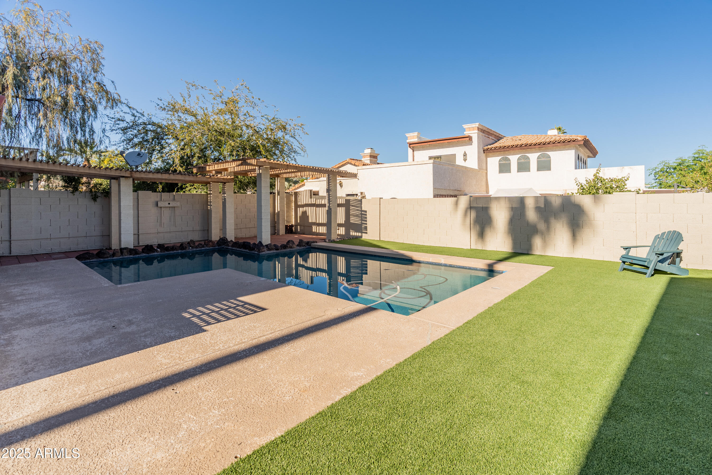 4652 East Piedmont Road Phoenix, AZ 85044 - Photo 23 of 30 a view of a swimming pool with an outdoor seating and a yard