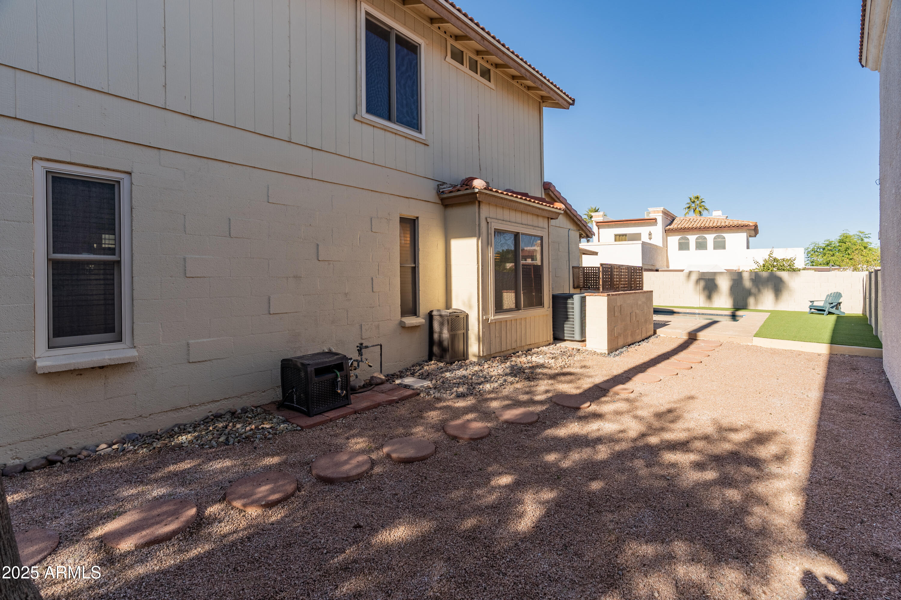 4652 East Piedmont Road Phoenix, AZ 85044 - Photo 26 of 30 a view of a house with a snow in the yard