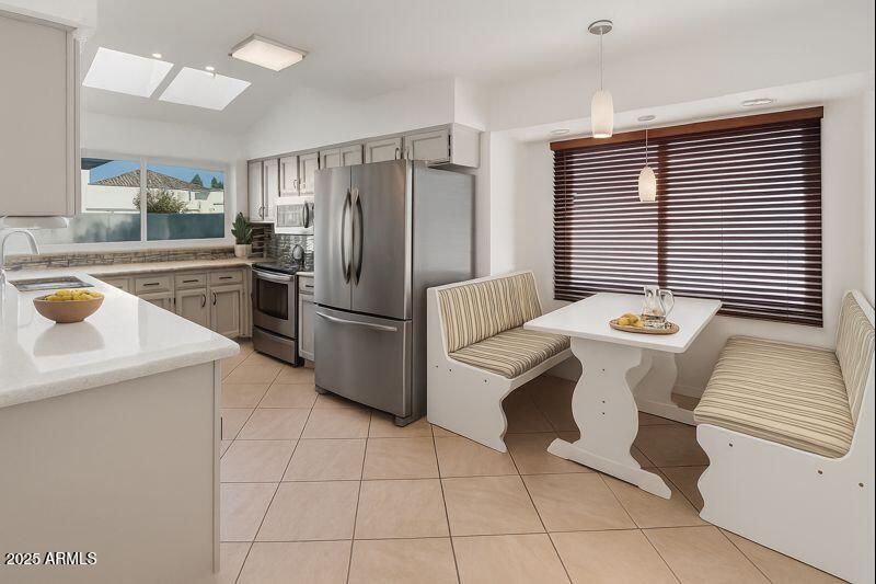 4652 East Piedmont Road Phoenix, AZ 85044 - Photo 4 of 30 a kitchen with a sink appliances and cabinets