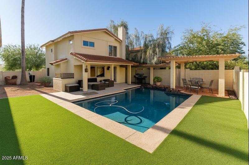 4652 East Piedmont Road Phoenix, AZ 85044 - Photo 5 of 30 a view of a house with swimming pool