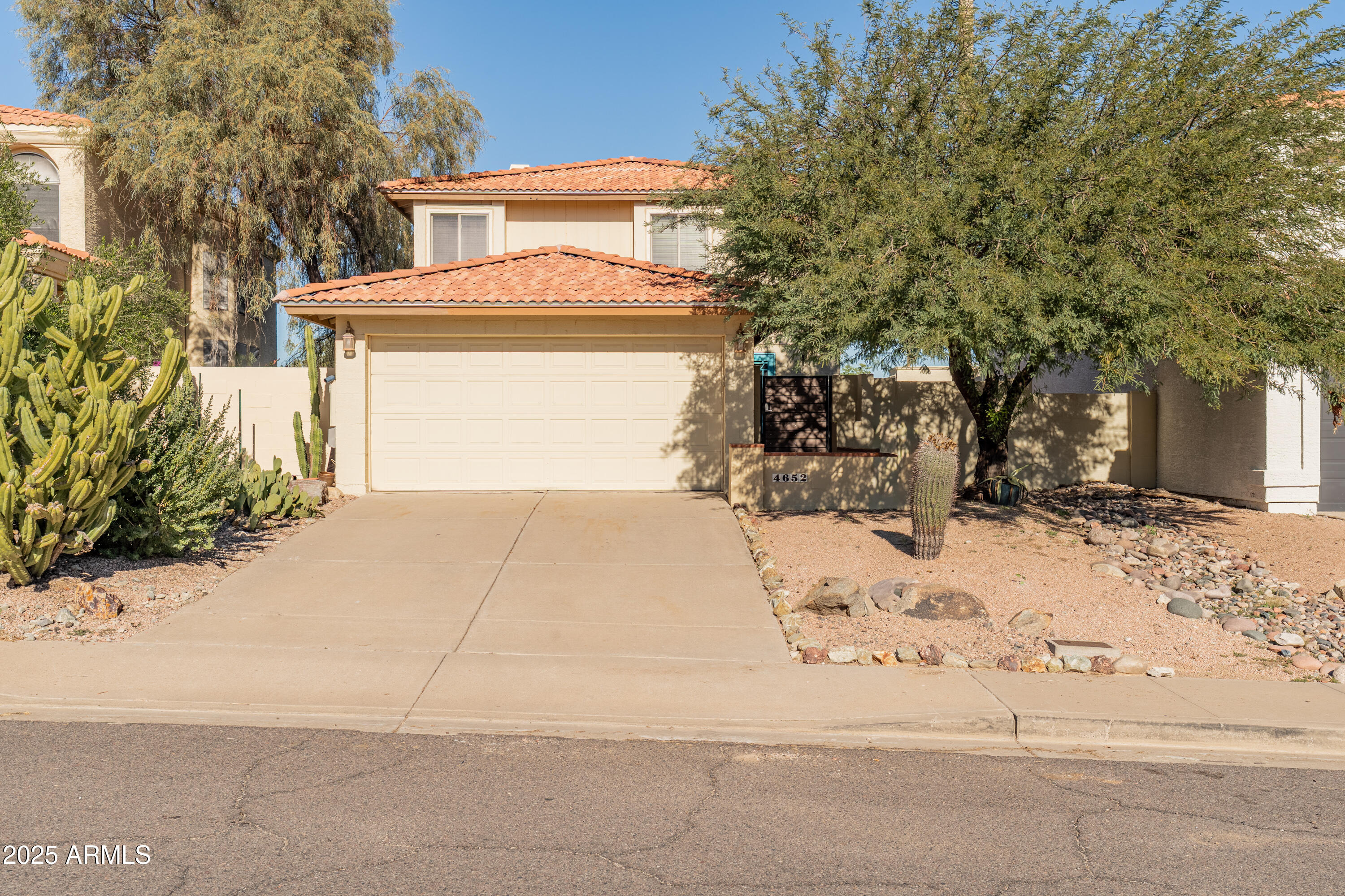 4652 East Piedmont Road Phoenix, AZ 85044 - Photo 6 of 30 a view of a house with snow on the road