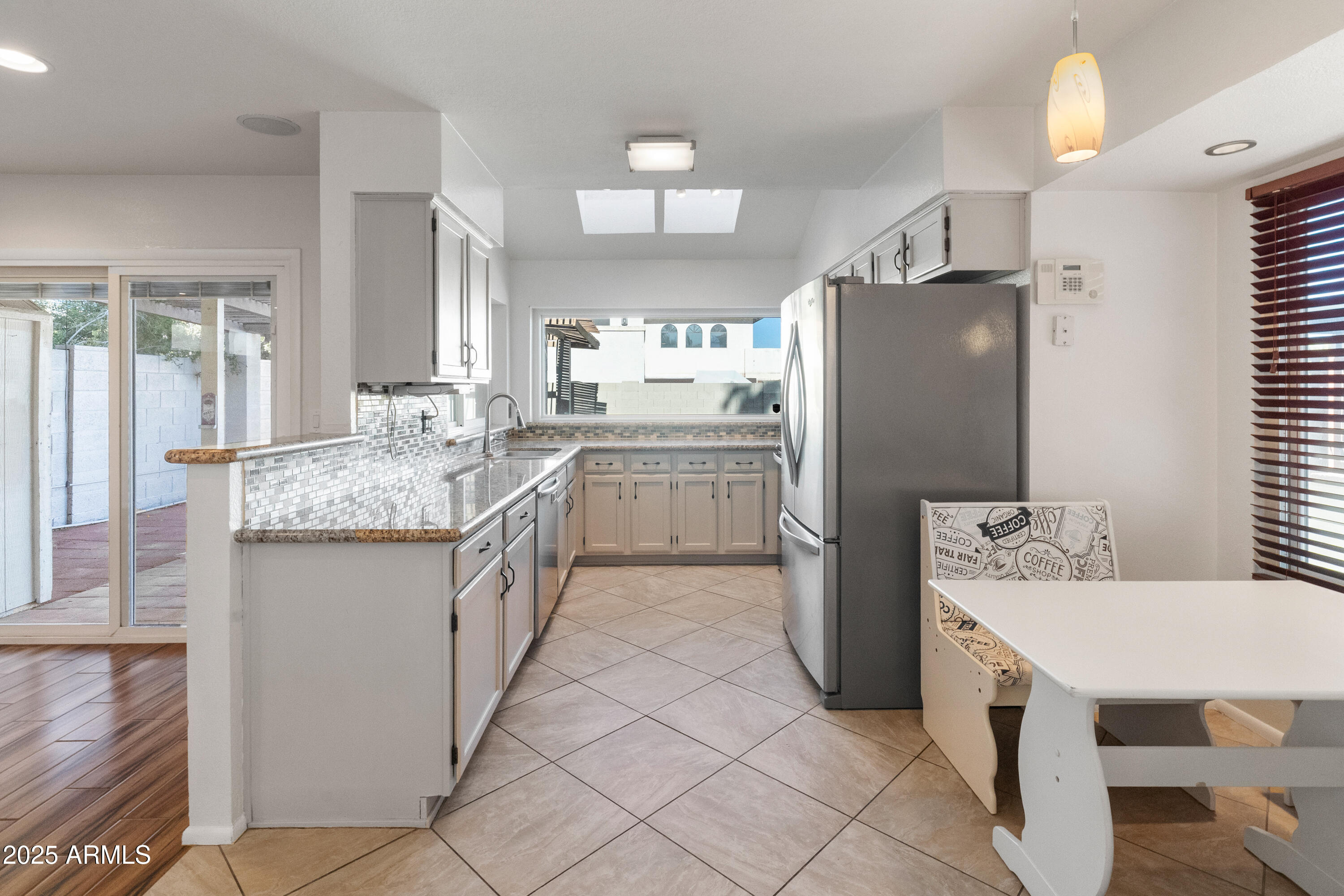 4652 East Piedmont Road Phoenix, AZ 85044 - Photo 7 of 30 a kitchen with a sink stove and refrigerator