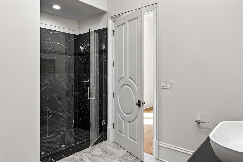 5320 Riverview Road Northwest Atlanta, GA 30339 - Photo 41 of 83 a bathroom with a shower and a mirror