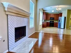 a view of a kitchen and an entryway