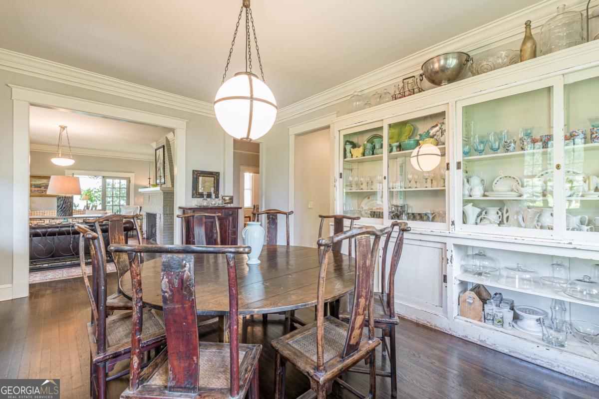 1878 Cambridge Avenue Atlanta, GA 30337 - Photo 15 of 84 a dining room with furniture a chandelier and wooden floor