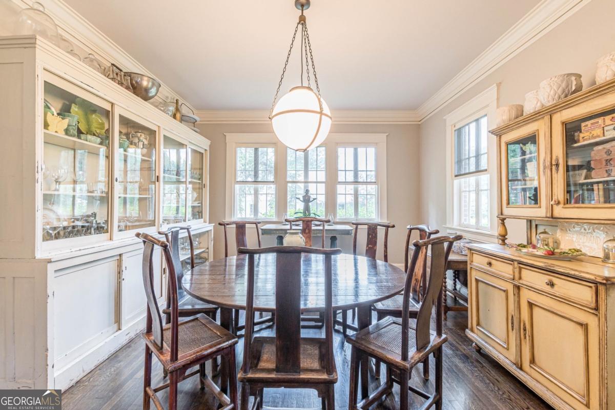 1878 Cambridge Avenue Atlanta, GA 30337 - Photo 16 of 84 a view of a dining room with furniture large windows and wooden floor