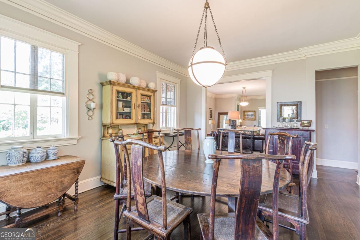 1878 Cambridge Avenue Atlanta, GA 30337 - Photo 21 of 84 a view of a dining room with furniture and chandelier
