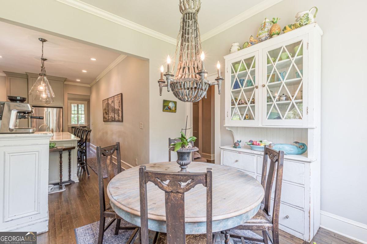 1878 Cambridge Avenue Atlanta, GA 30337 - Photo 26 of 84 a view of a dining room with furniture a chandelier and wooden floor