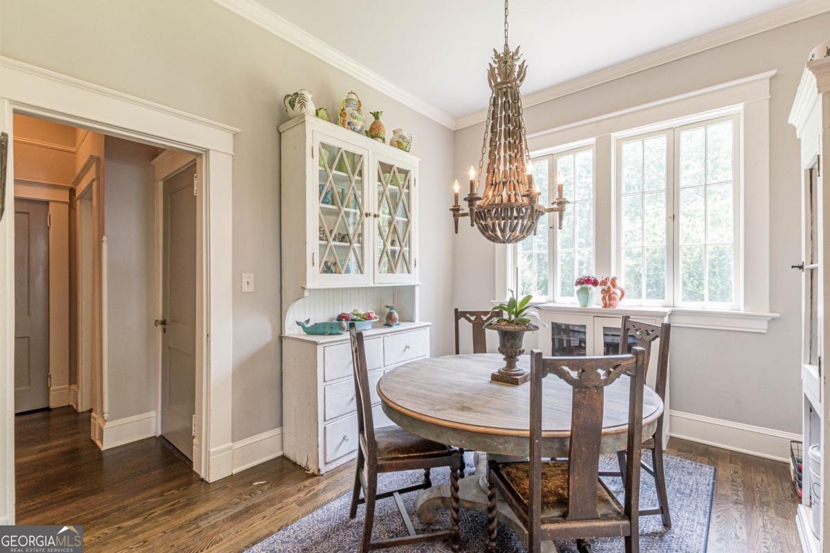 1878 Cambridge Avenue Atlanta, GA 30337 - Photo 29 of 84 a view of a dining room with furniture windows and wooden floor
