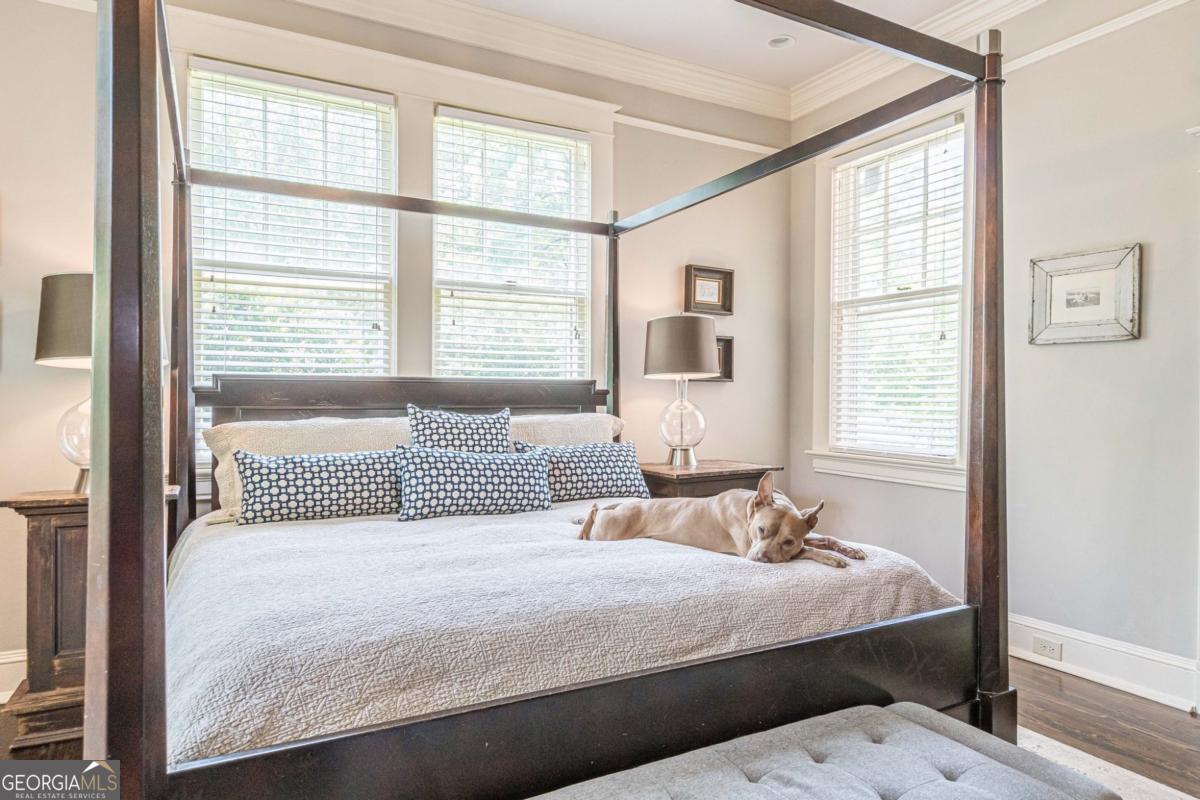 1878 Cambridge Avenue Atlanta, GA 30337 - Photo 30 of 84 a bedroom with a large bed and a window