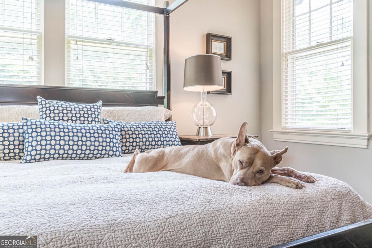 1878 Cambridge Avenue Atlanta, GA 30337 - Photo 31 of 84 a bedroom with a bed and a window