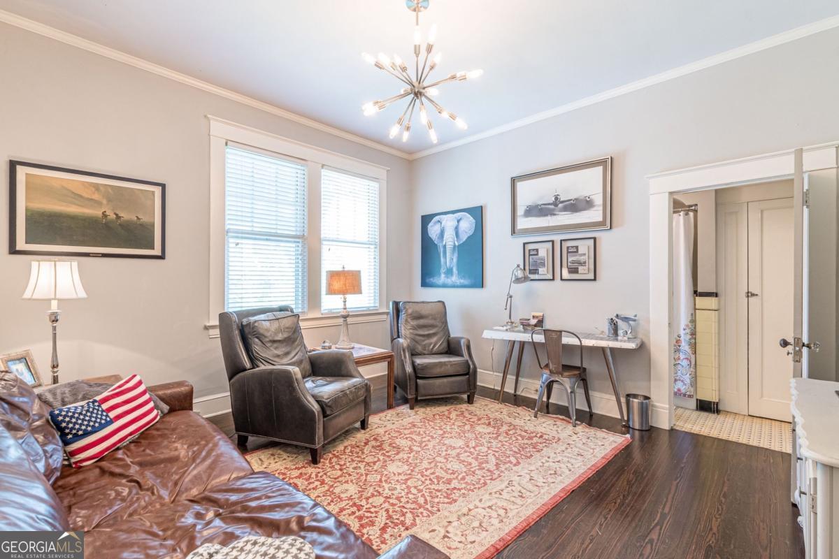 1878 Cambridge Avenue Atlanta, GA 30337 - Photo 44 of 84 a living room with furniture and a chandelier