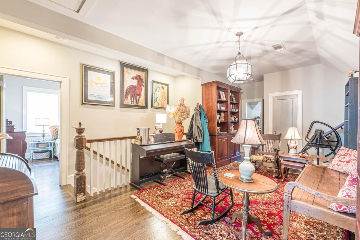 1878 Cambridge Avenue Atlanta, GA 30337 - Photo 59 of 84 a living room with lots of furniture and a wooden floor