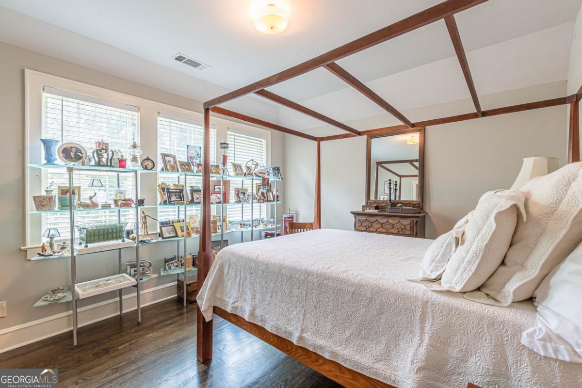 1878 Cambridge Avenue Atlanta, GA 30337 - Photo 61 of 84 a bedroom with a bed and a large window