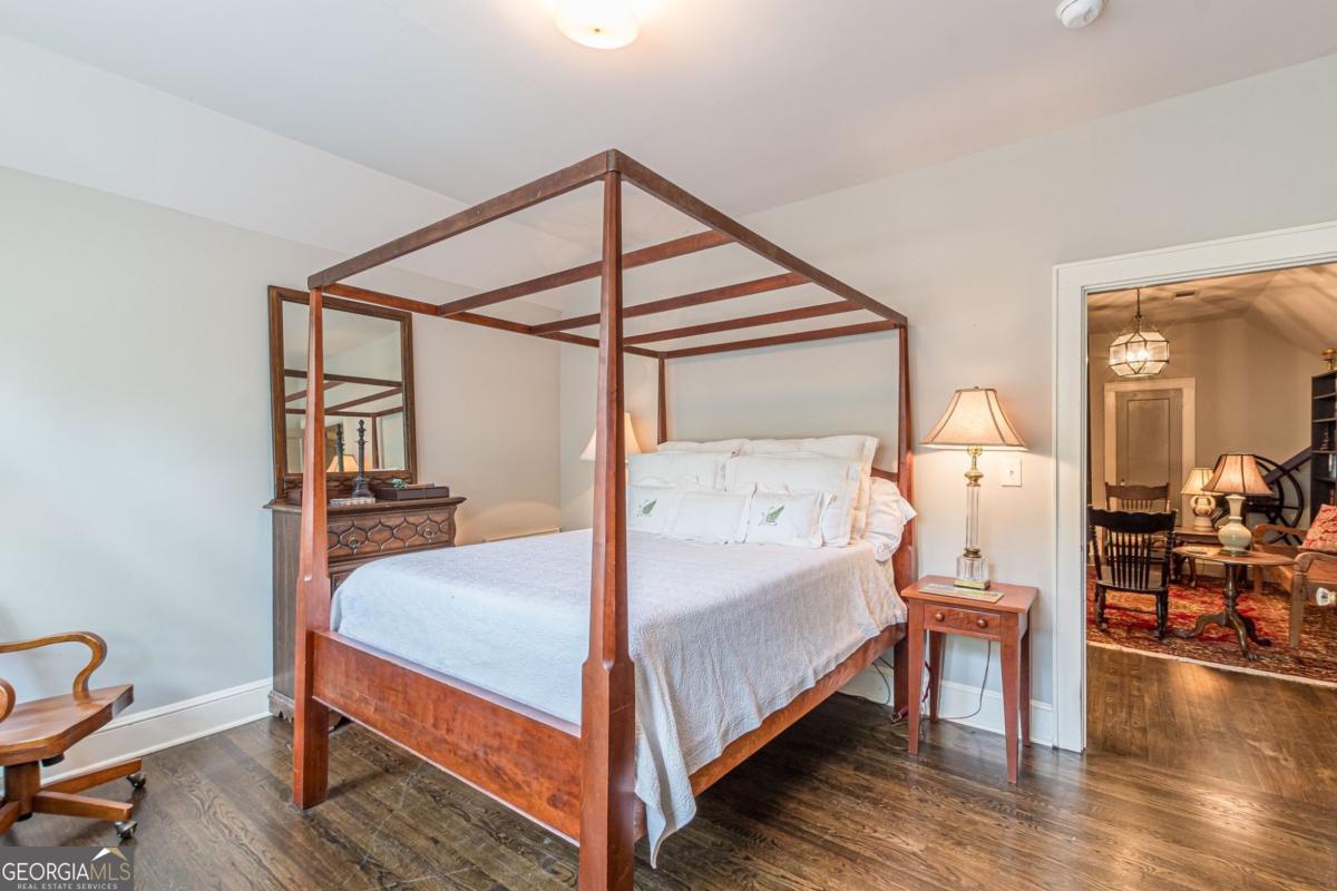 1878 Cambridge Avenue Atlanta, GA 30337 - Photo 62 of 84 a bedroom with a bed and wooden floor