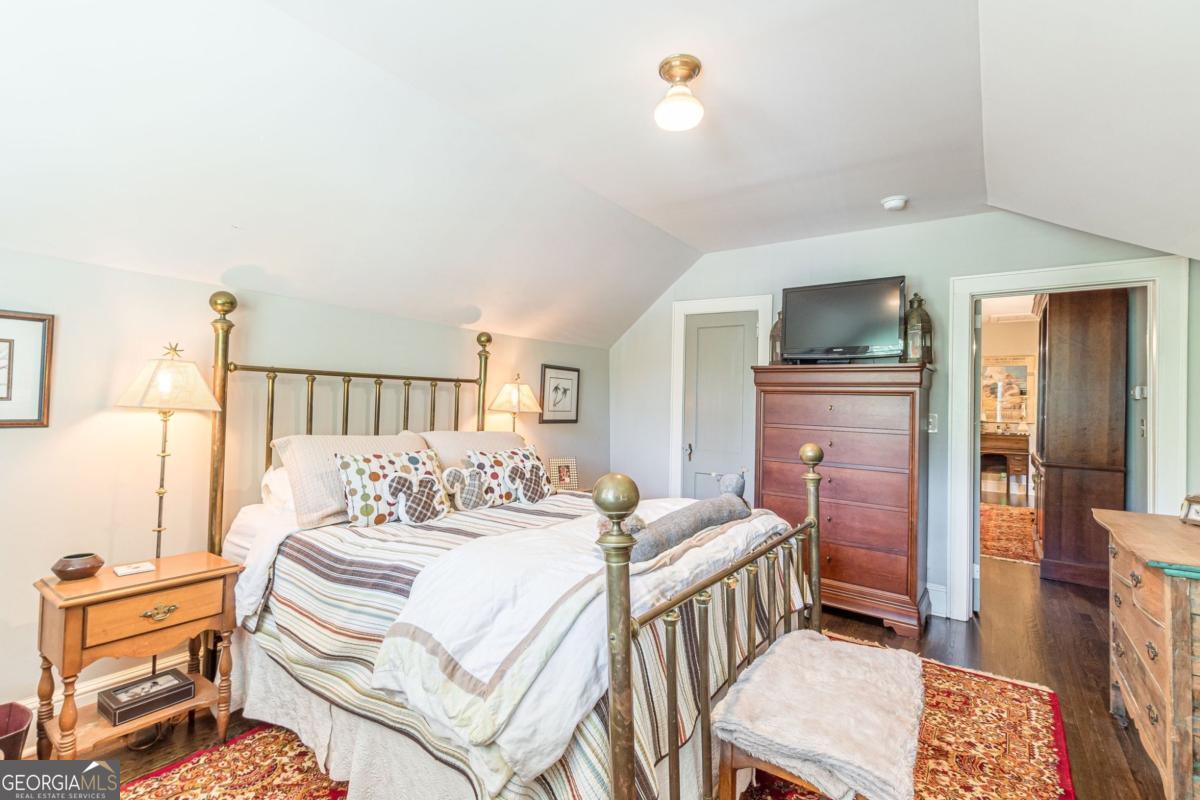 1878 Cambridge Avenue Atlanta, GA 30337 - Photo 63 of 84 a bedroom with a bed and a television