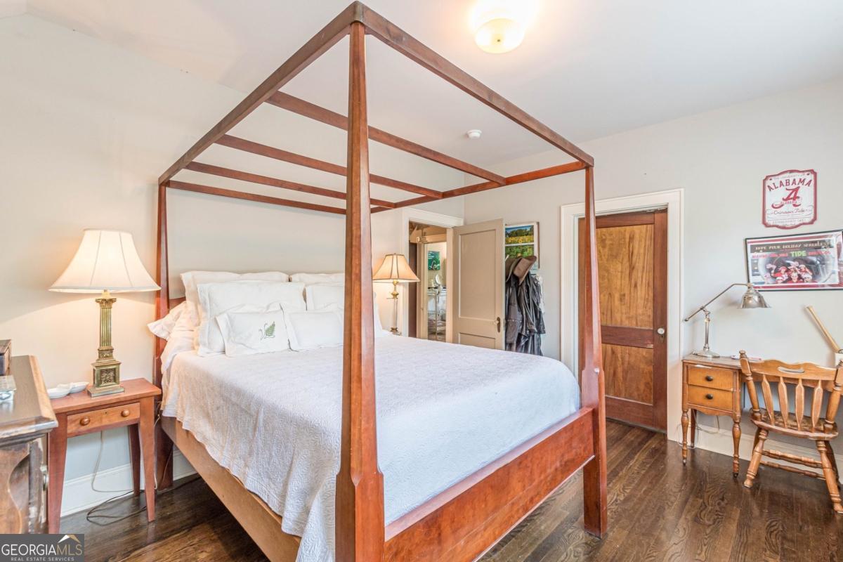 1878 Cambridge Avenue Atlanta, GA 30337 - Photo 67 of 84 a bedroom with a bed and a table