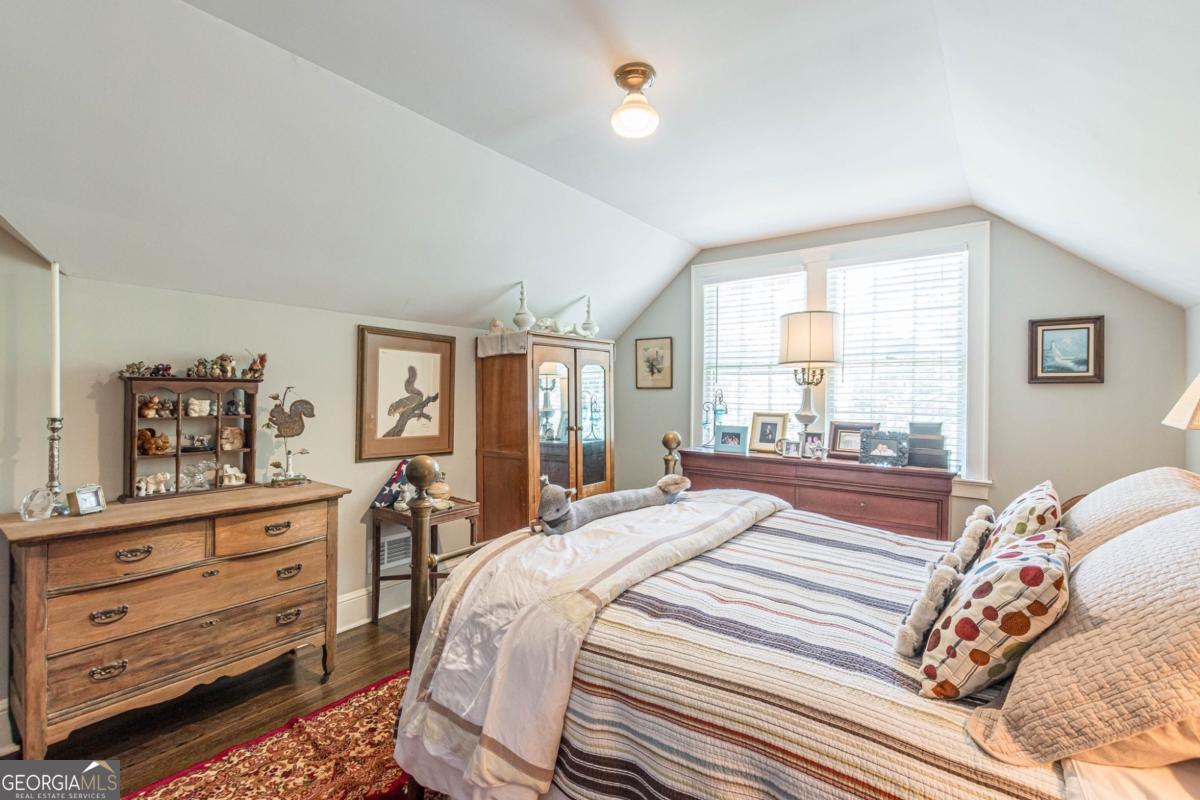 1878 Cambridge Avenue Atlanta, GA 30337 - Photo 73 of 84 a bedroom with a bed and a dresser