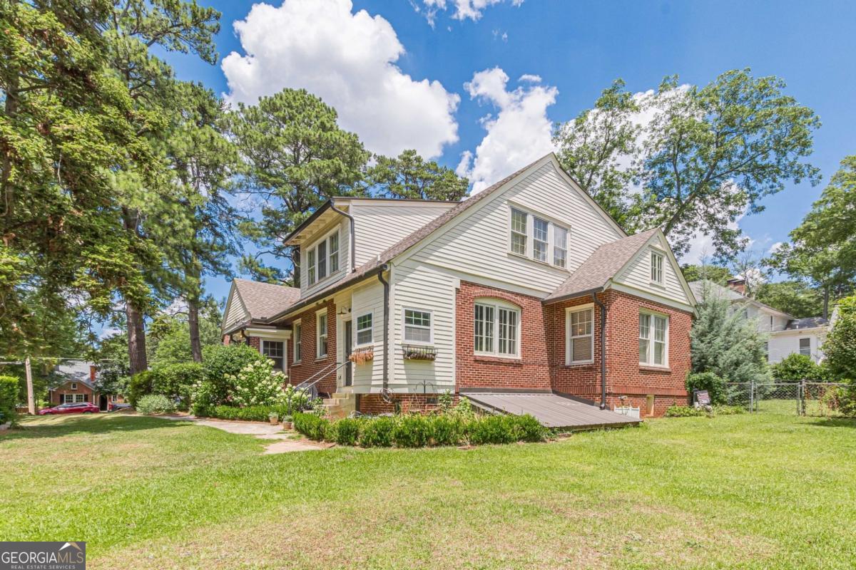 1878 Cambridge Avenue Atlanta, GA 30337 - Photo 79 of 84 a front view of a house with a garden
