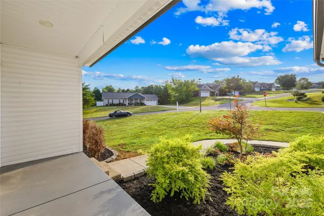 a backyard of a house with lots of green space