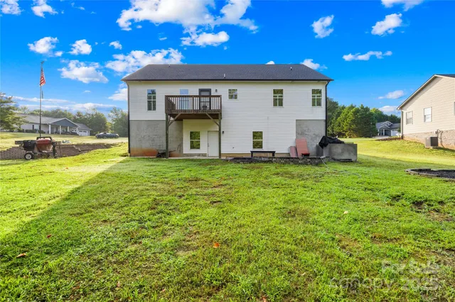 a view of a house with backyard porch and sitting area