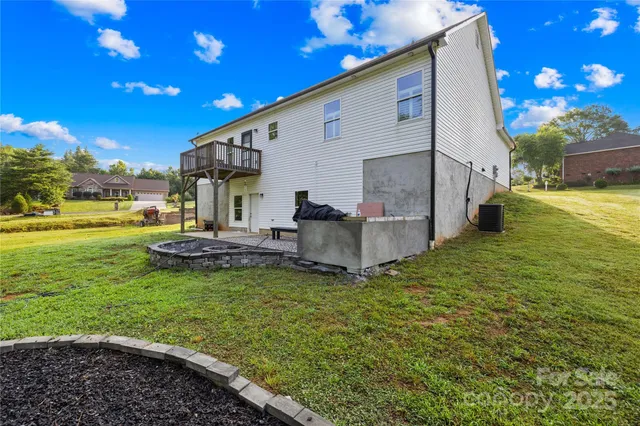 a view of a backyard with sitting area