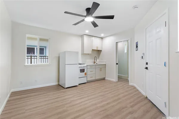 a kitchen with stainless steel appliances a refrigerator and a stove