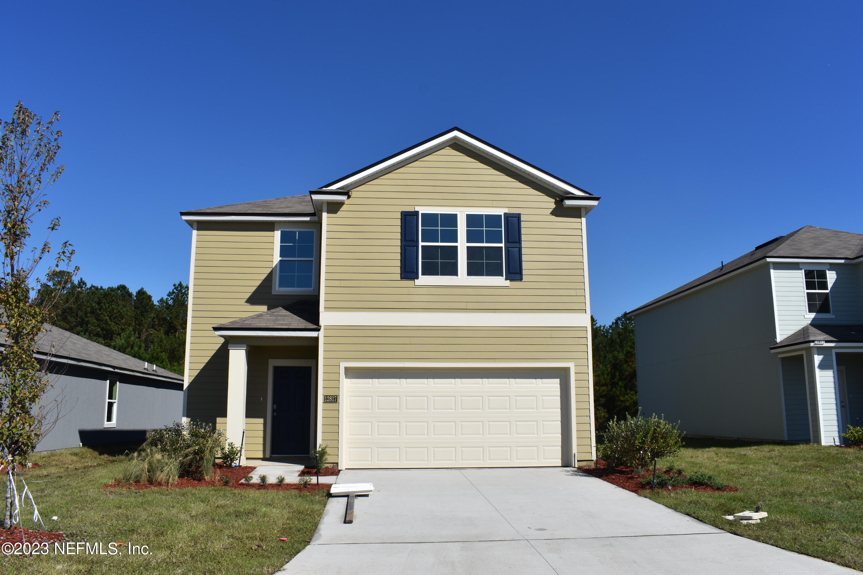 12817 Cacao Tree Trail Jacksonville, FL 32218 - Photo 1 of 41 a front view of house with yard