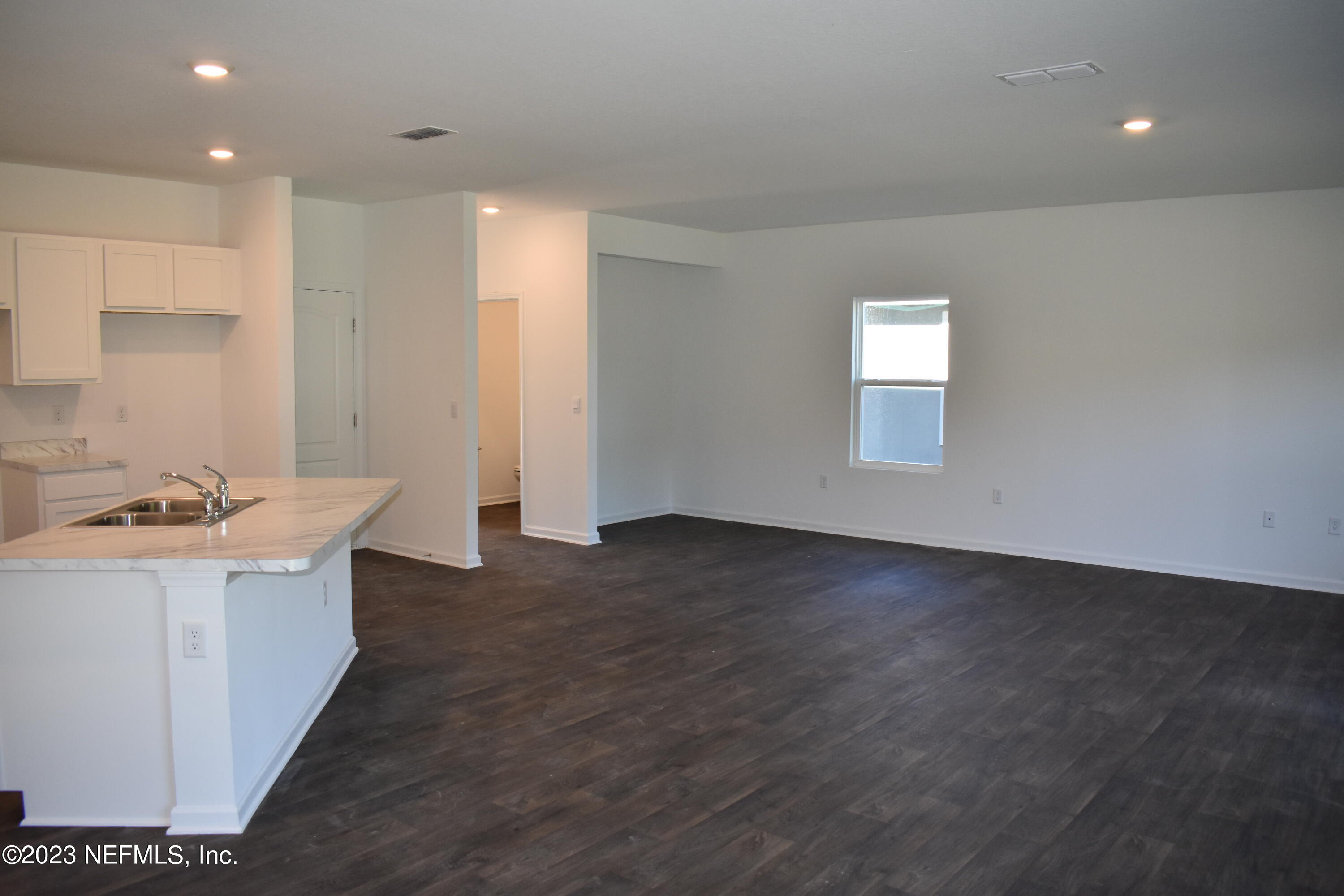 12817 Cacao Tree Trail Jacksonville, FL 32218 - Photo 11 of 41 a kitchen with kitchen island sink and faucet