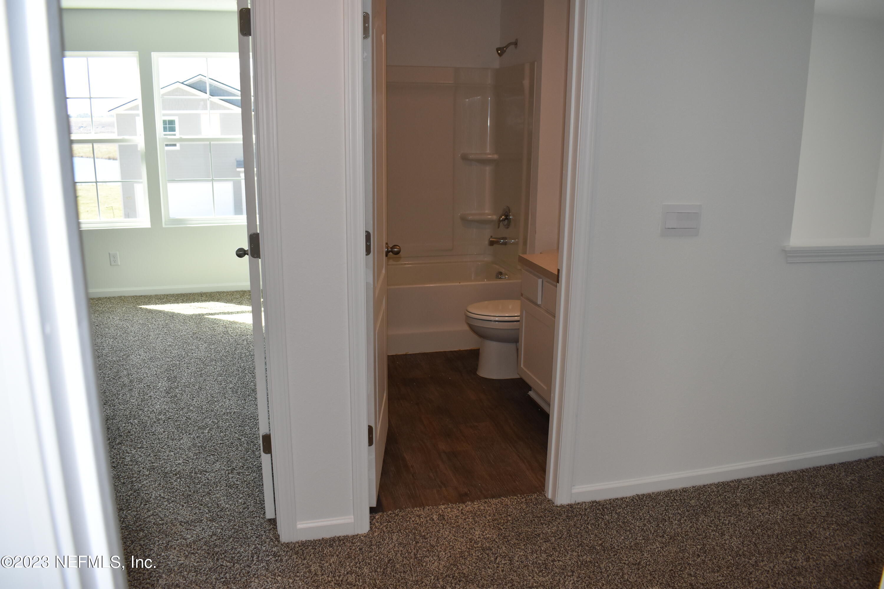 12817 Cacao Tree Trail Jacksonville, FL 32218 - Photo 16 of 41 a bathroom with a toilet