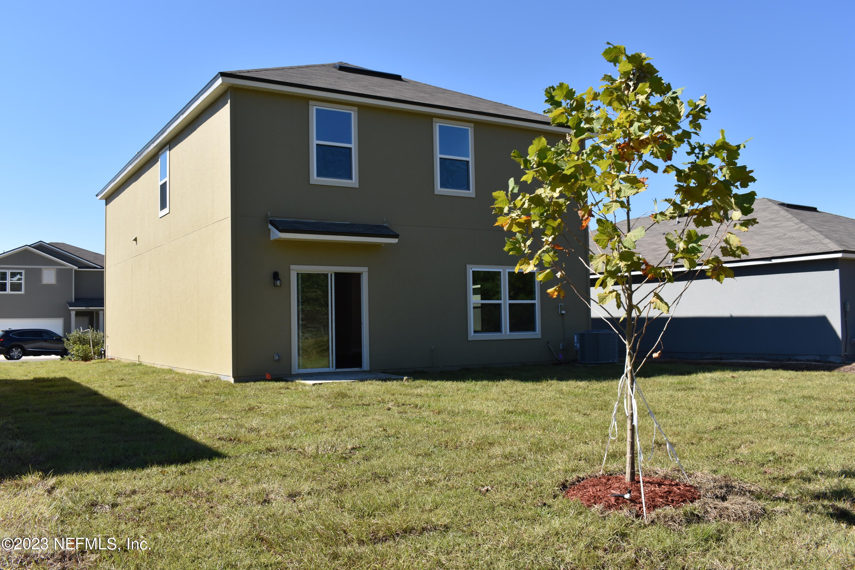 12817 Cacao Tree Trail Jacksonville, FL 32218 - Photo 24 of 41 a house that has a tree in front of it