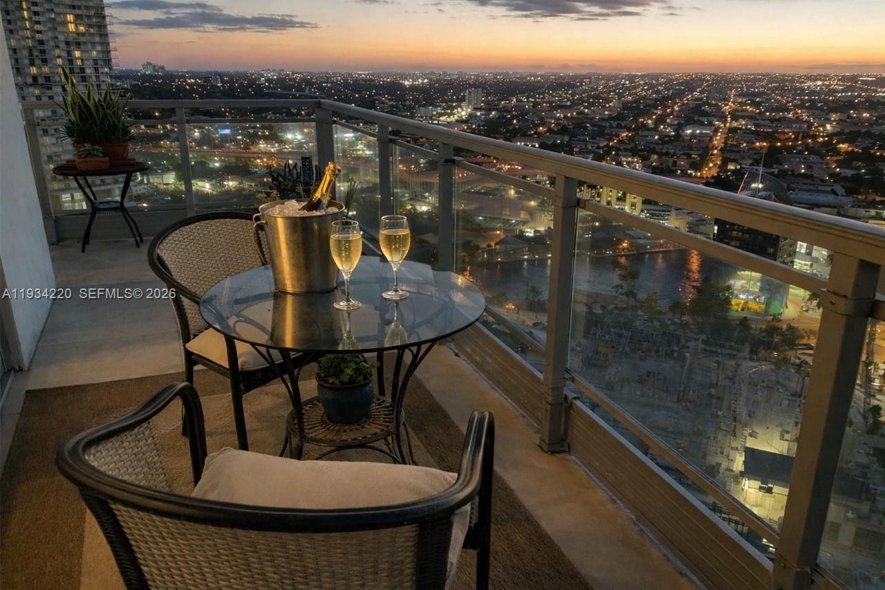 a view of a balcony with furniture