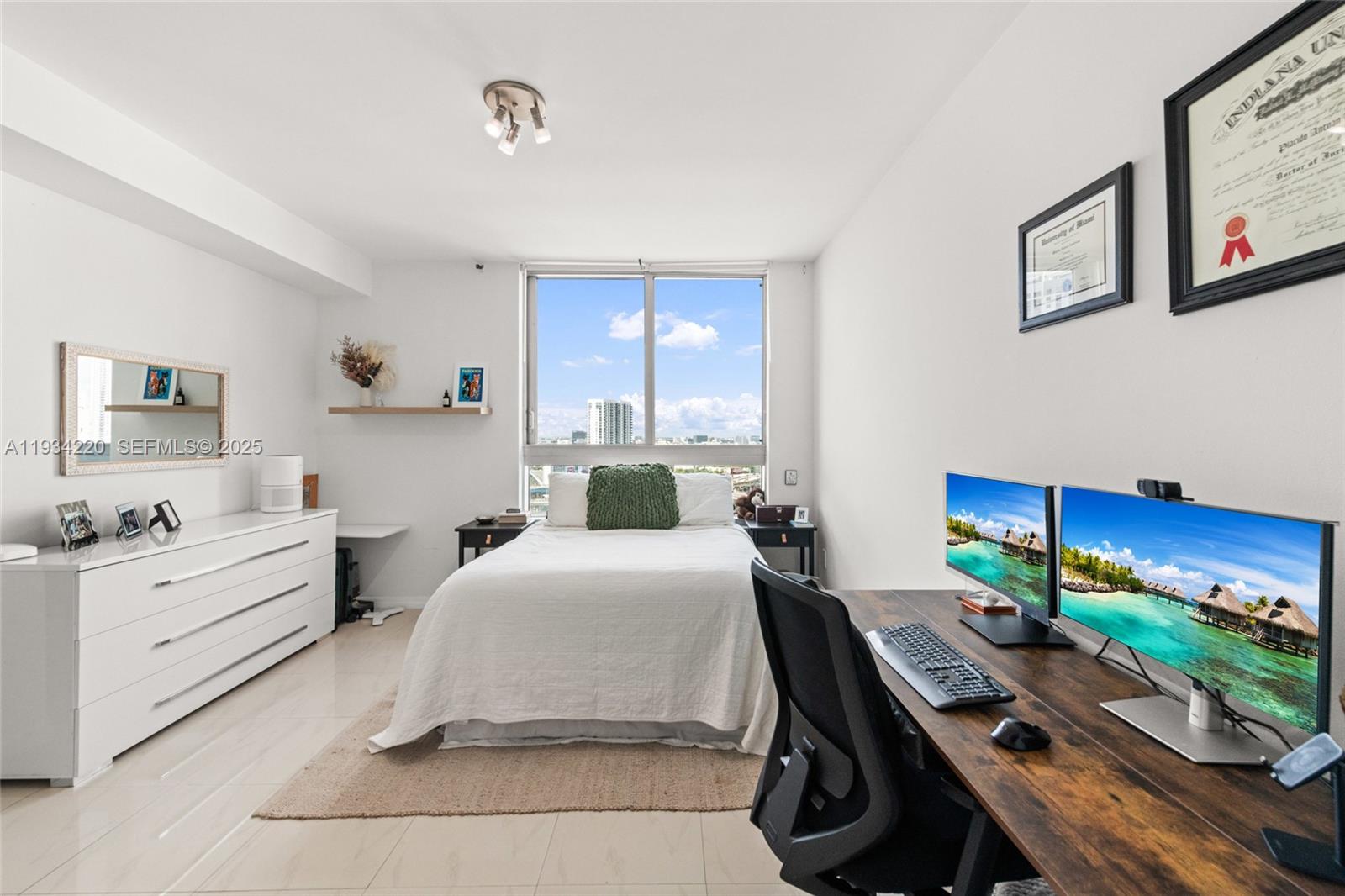 90 Southwest 3rd Street, Unit 2109 Miami, FL 33130 - Photo 16 of 29 a bedroom with a bed and furniture