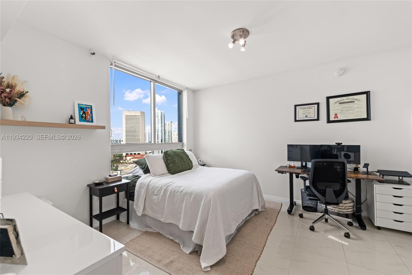 90 Southwest 3rd Street, Unit 2109 Miami, FL 33130 - Photo 19 of 31 a bedroom with a bed and a desk
