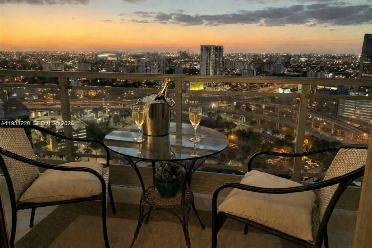 90 Southwest 3rd Street, Unit 2109 Miami, FL 33130 - Photo 2 of 31 a view of a chairs and table in the terrace
