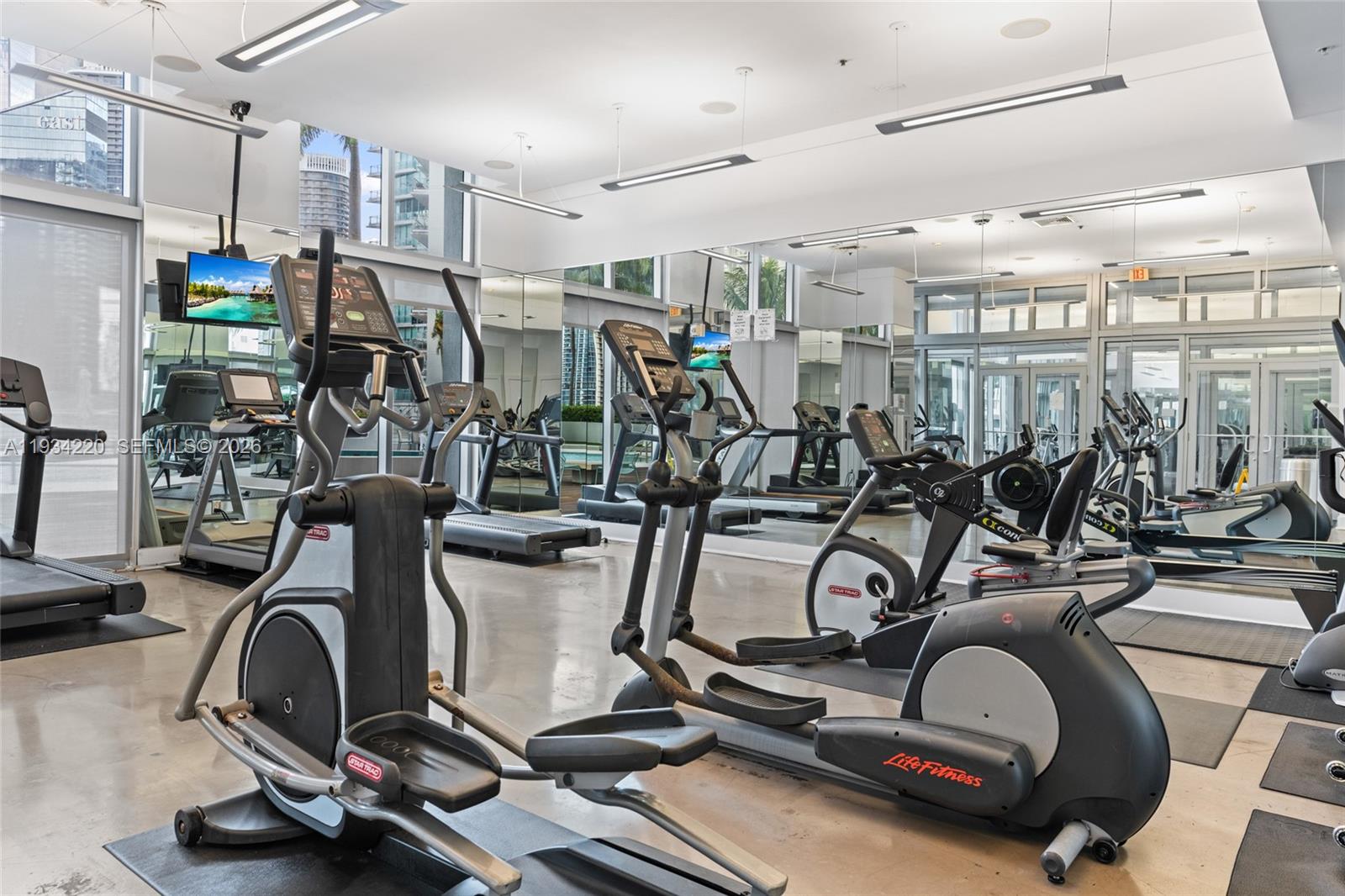90 Southwest 3rd Street, Unit 2109 Miami, FL 33130 - Photo 24 of 31 a view of a room with gym equipment