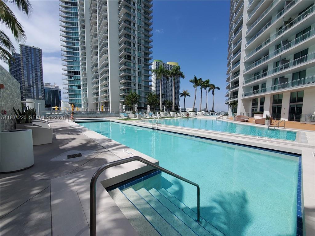 90 Southwest 3rd Street, Unit 2109 Miami, FL 33130 - Photo 27 of 31 a house with swimming pool in front of it