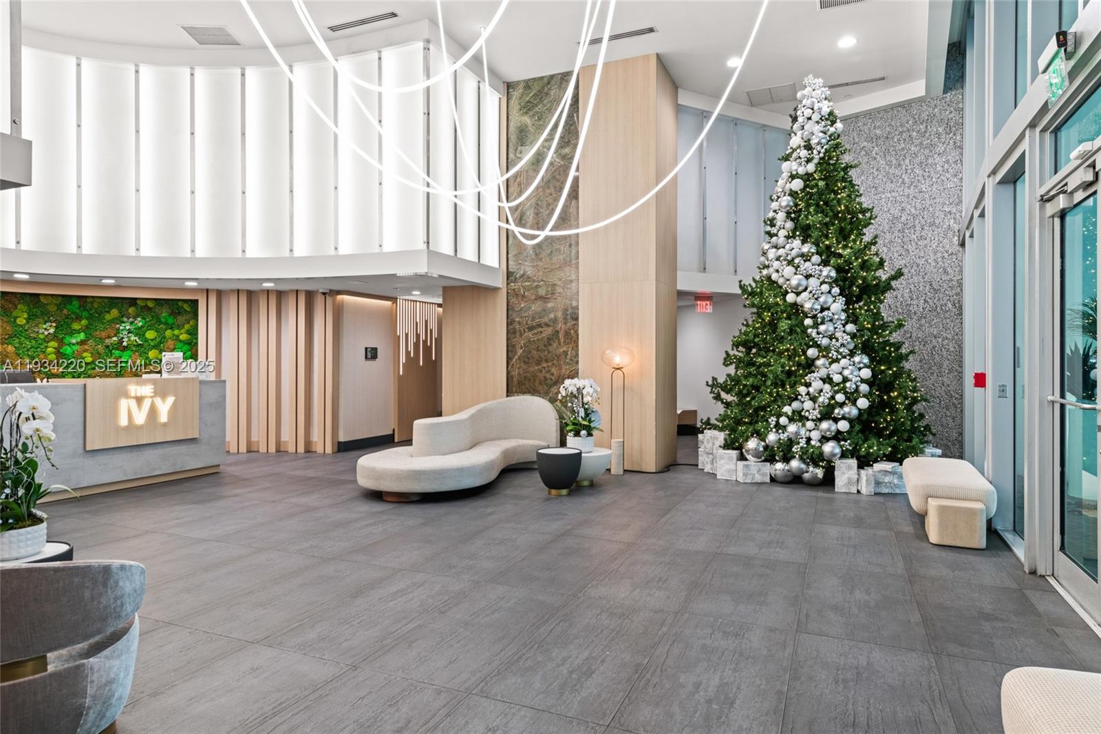 90 Southwest 3rd Street, Unit 2109 Miami, FL 33130 - Photo 6 of 29 a living room with furniture and a potted plant