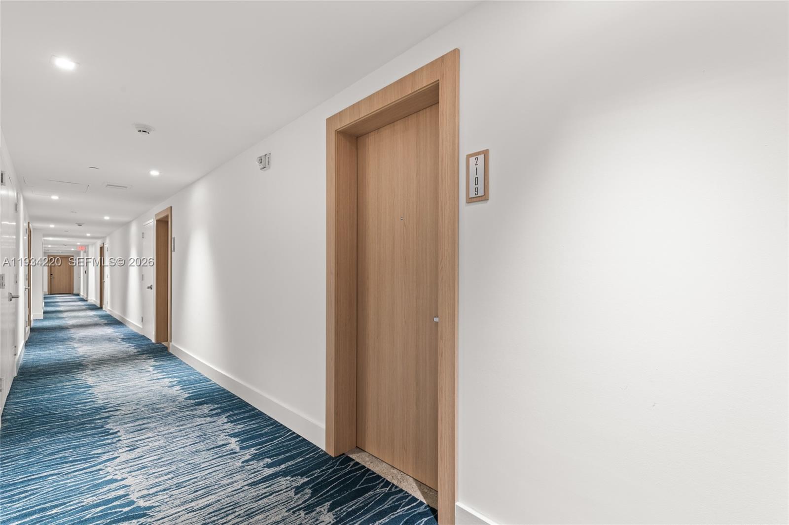 90 Southwest 3rd Street, Unit 2109 Miami, FL 33130 - Photo 9 of 31 a view of a hallway with wooden floor