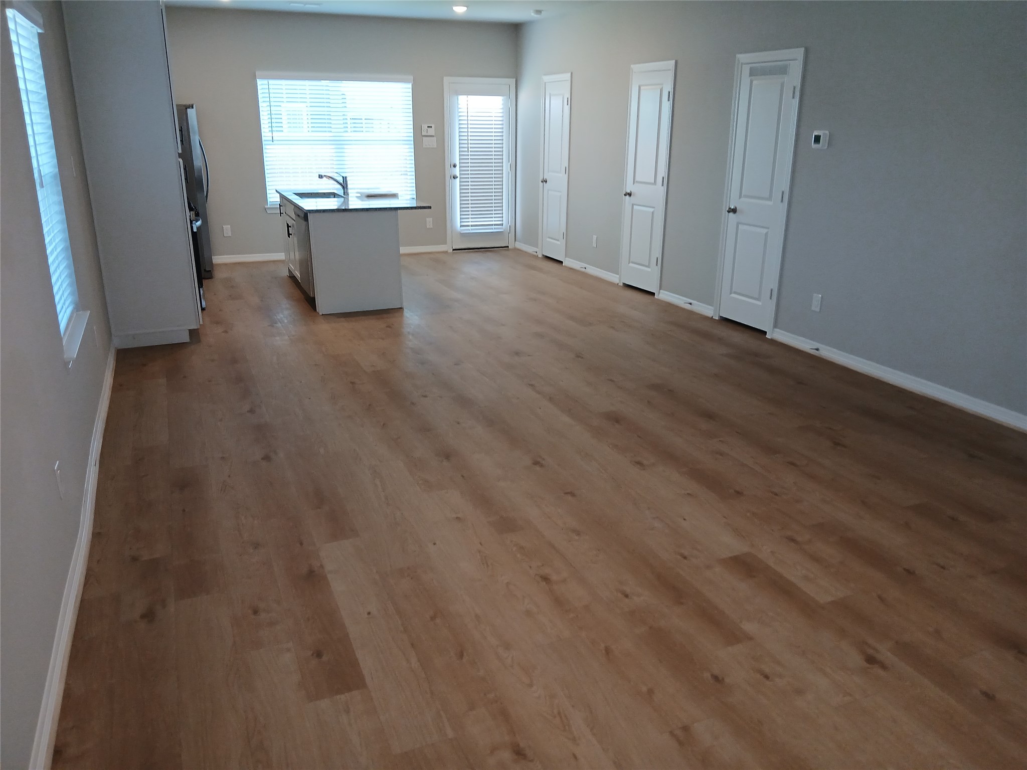 6403 Paris Street Houston, TX 77021 - Photo 6 of 16 wooden floor in an empty room with a window