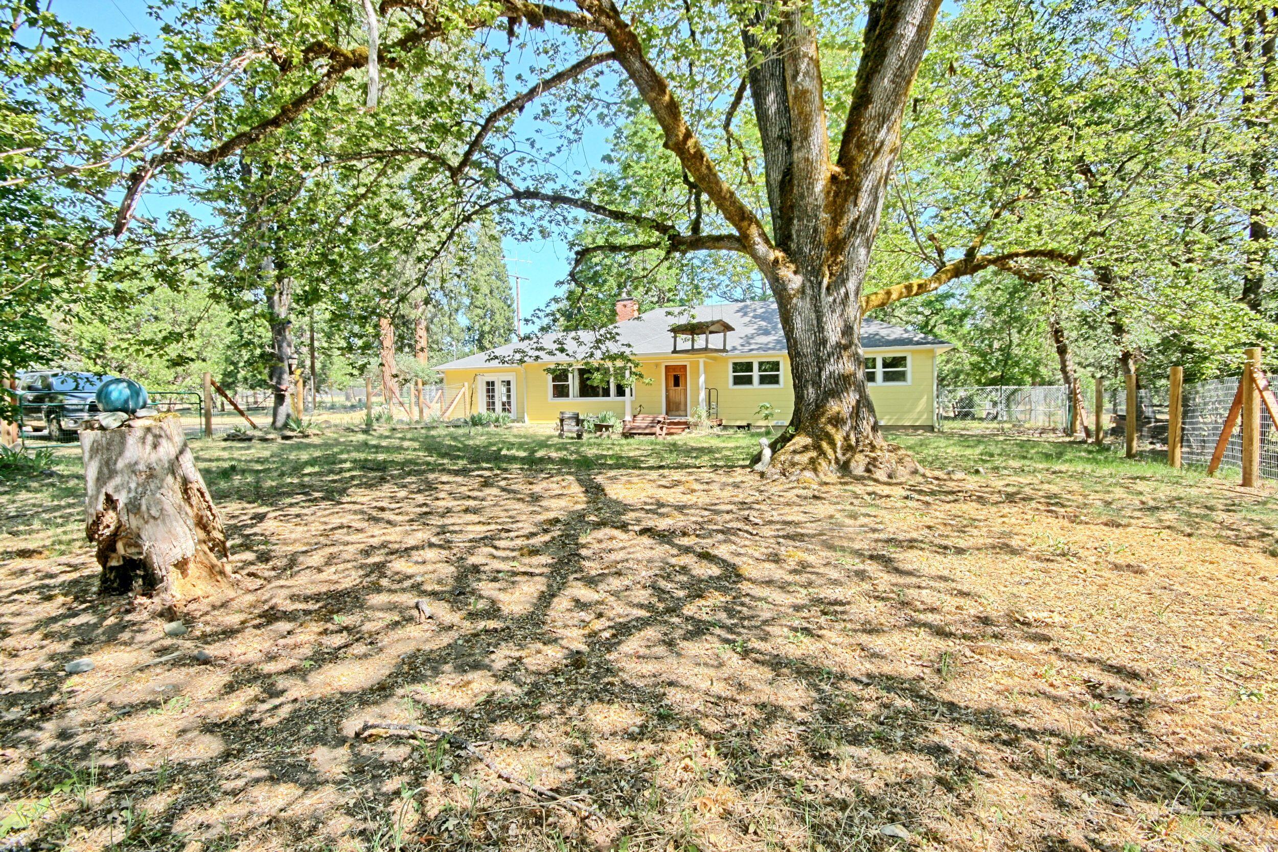 199 Powell Creek Road Williams, OR 97544 - Photo 5 of 57 a front view of a house with a yard