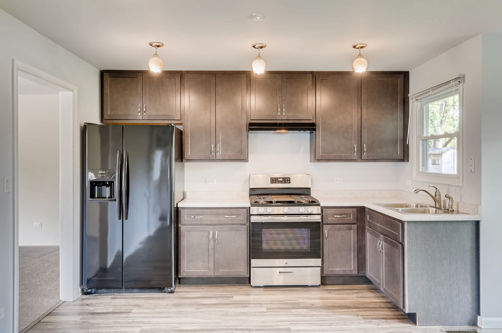 3104 Dove Court Rolling Meadows, IL 60008 - Photo 4 of 12 a kitchen with stainless steel appliances a sink stove and refrigerator