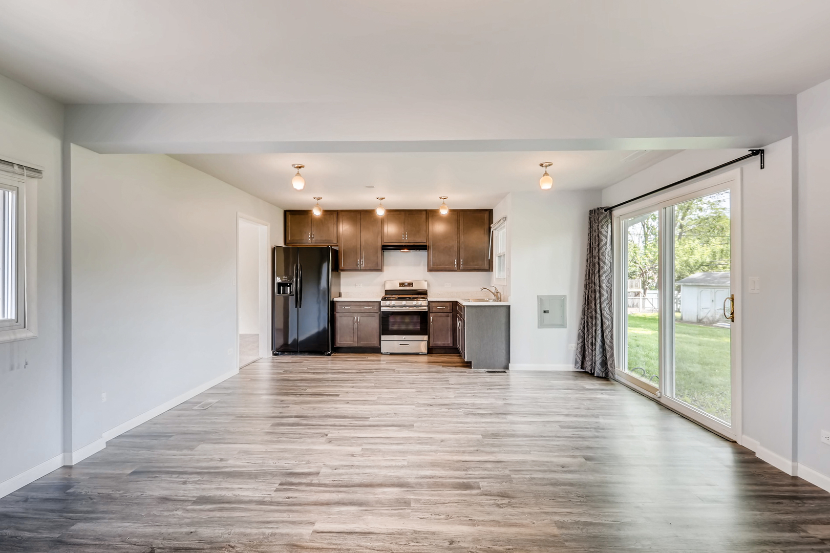 3104 Dove Court Rolling Meadows, IL 60008 - Photo 6 of 12 a view of a kitchen with a sink and dishwasher with wooden floor