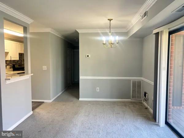 wooden floor in an empty room and a mirror