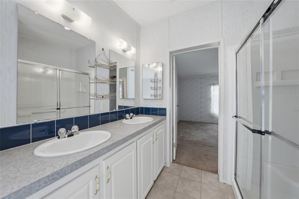 11923 Southwest Loop Terrace Arcadia, FL 34269 - Photo 23 of 50 a bathroom with a granite countertop sink mirror and double
