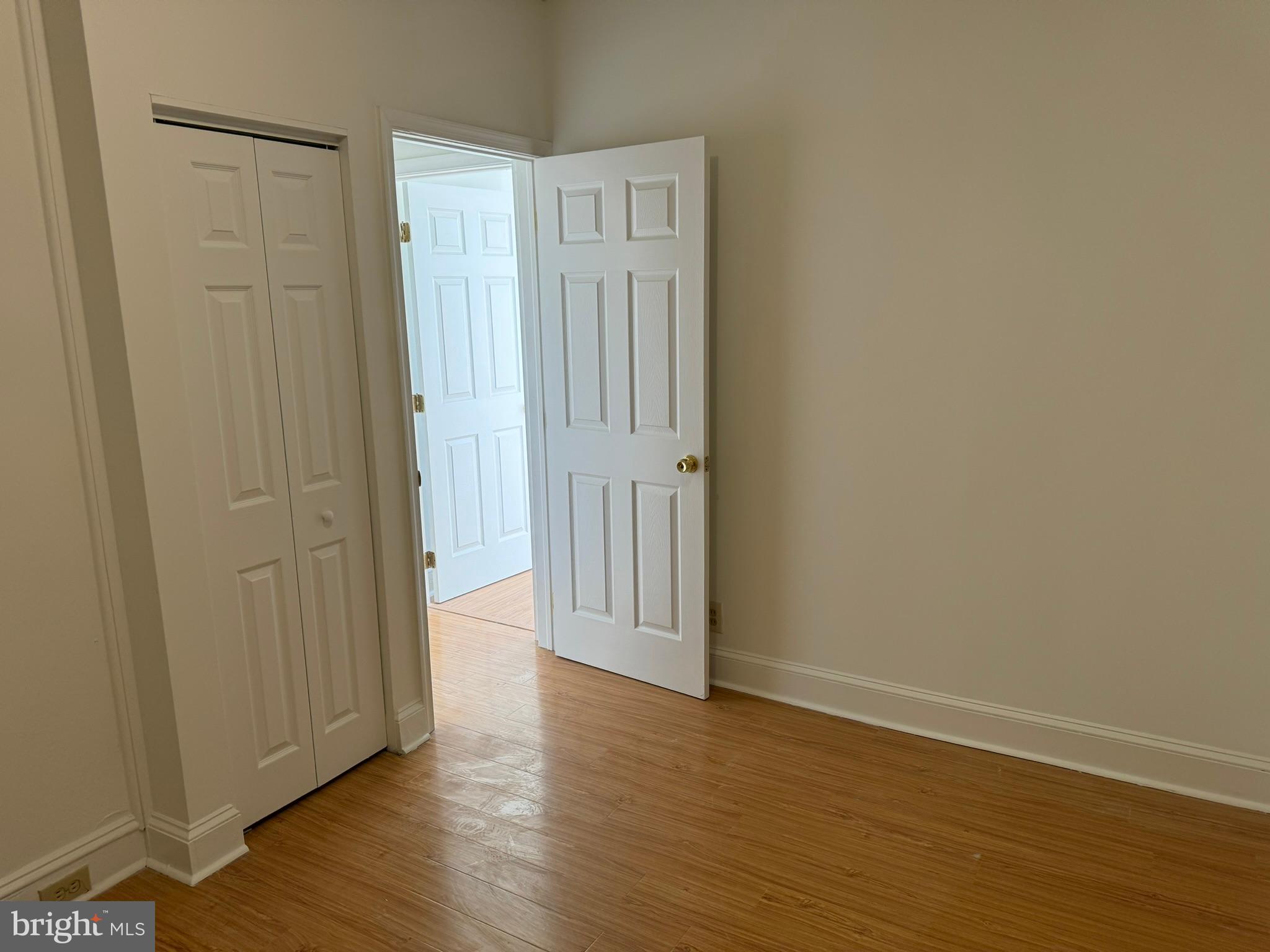 1 North Main Street, Unit 2F Ambler, PA 19002 - Photo 18 of 23 a view of an empty room with wooden floor