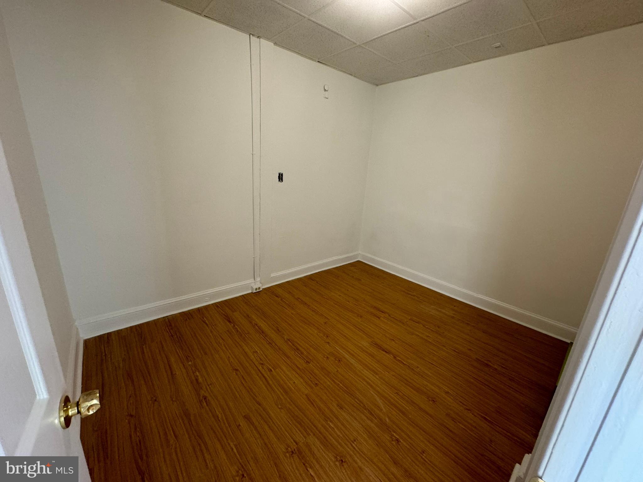 1 North Main Street, Unit 2F Ambler, PA 19002 - Photo 19 of 23 a view of an empty room with wooden floor and a window