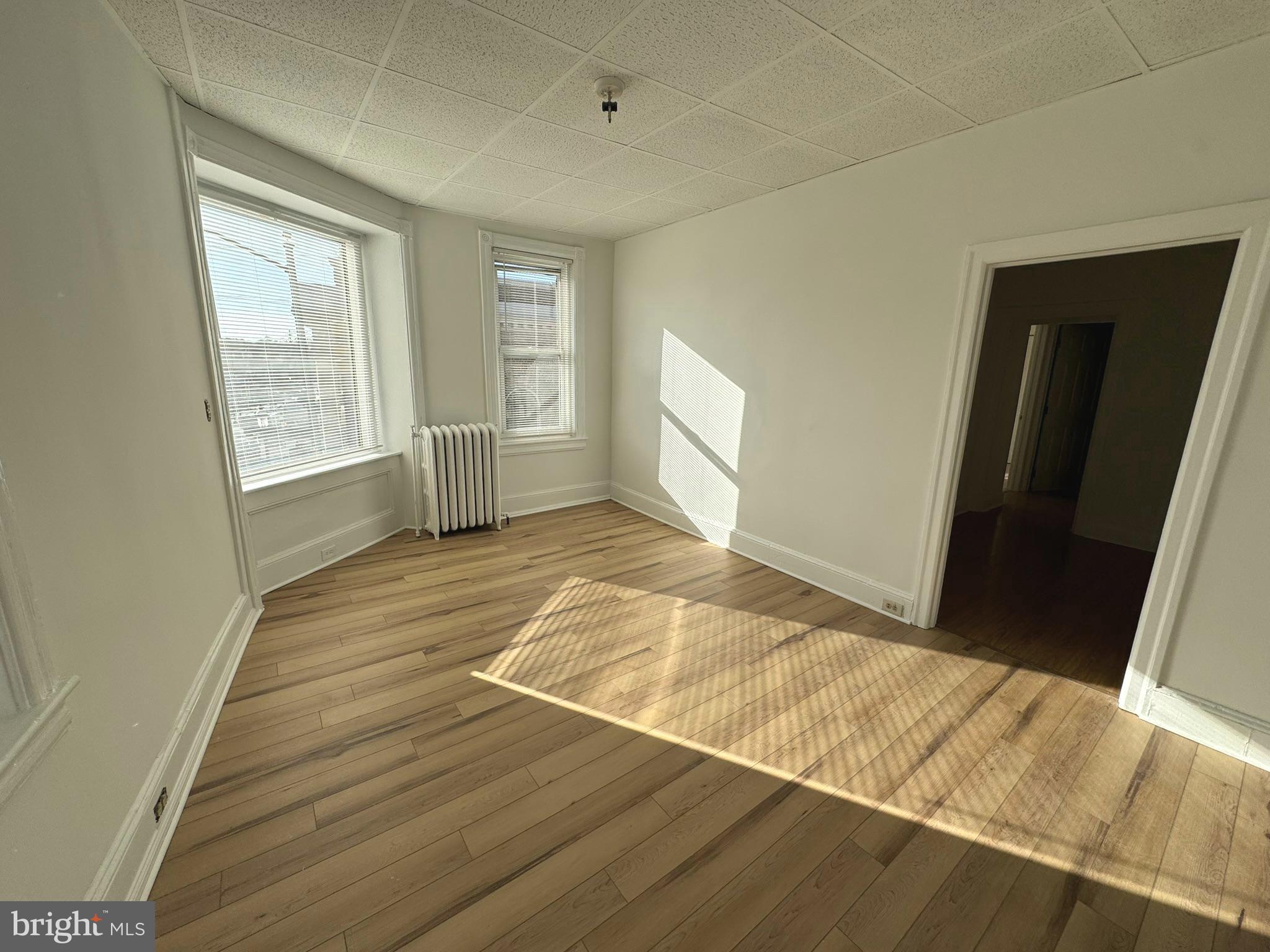 1 North Main Street, Unit 2F Ambler, PA 19002 - Photo 6 of 23 a view of an empty room and window