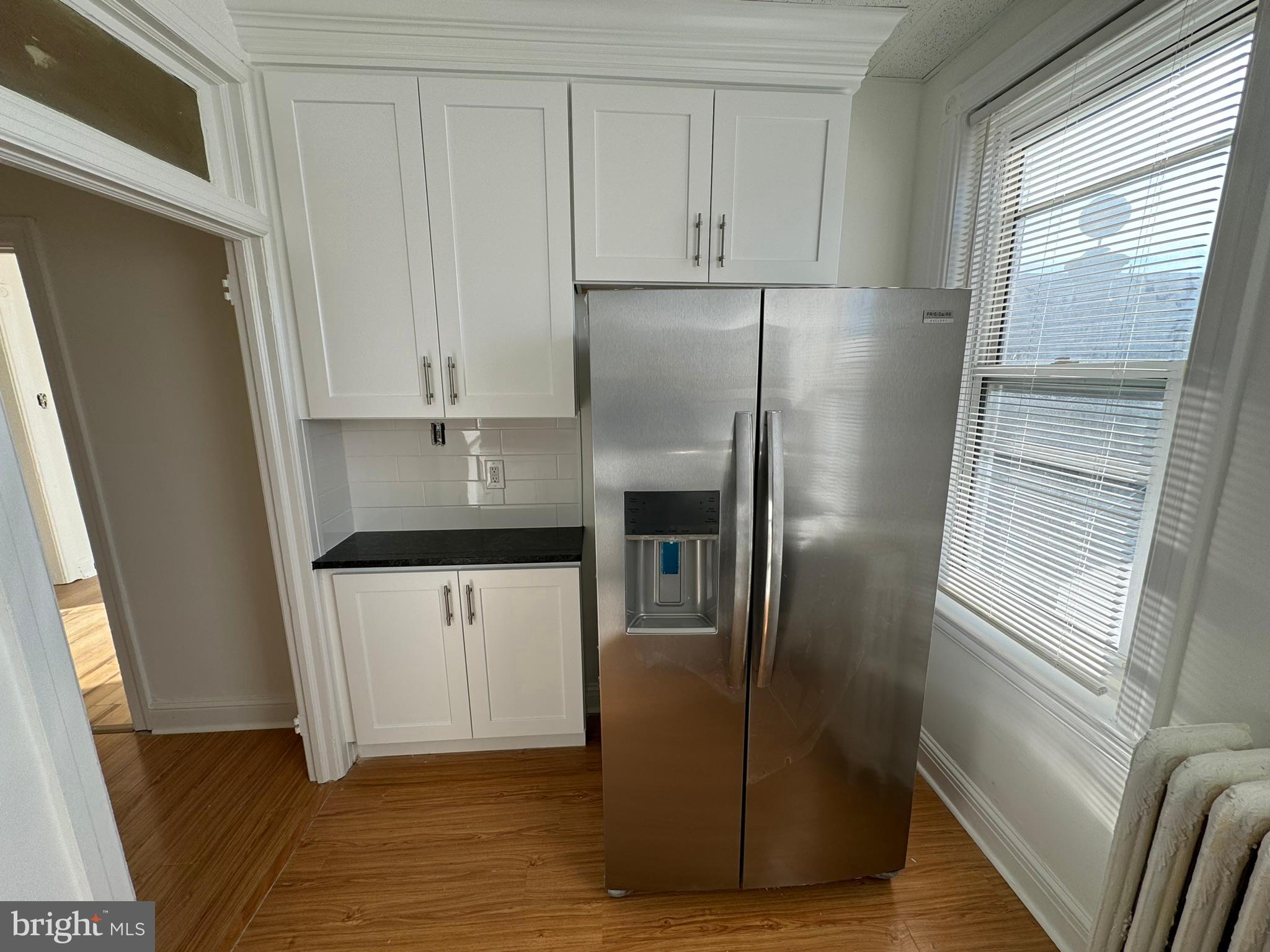 1 North Main Street, Unit 2F Ambler, PA 19002 - Photo 10 of 23 a kitchen with stainless steel appliances a refrigerator sink and cabinets